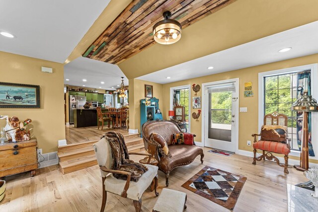 1313 Stayton Rd, Cumberland Furnace, TN 37051 - living area featuring wood finished floors, healthy amount of natural light, baseboards, recessed lighting, and a chandelier
