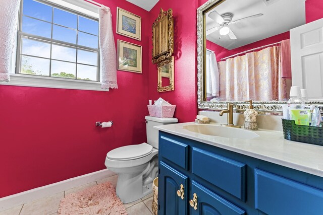 1313 Stayton Rd, Cumberland Furnace, TN 37051 - bathroom featuring tile patterned flooring, toilet, vanity, ceiling fan, and baseboards