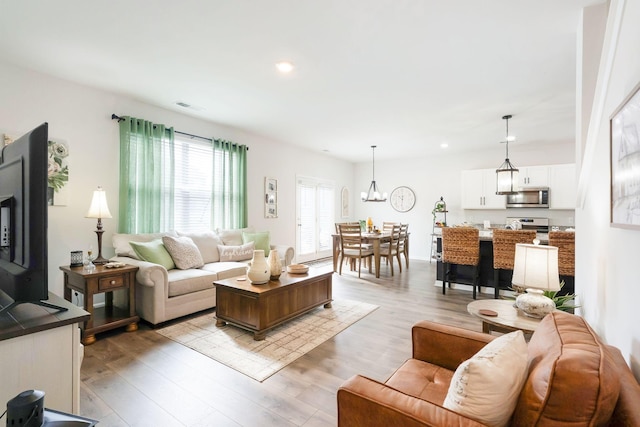 4043 Beach Way, White House, TN 37188 - living room with wood finished floors, recessed lighting, and a chandelier