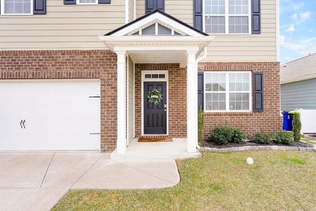 4043 Beach Way, White House, TN 37188 - doorway to property featuring brick siding and concrete driveway