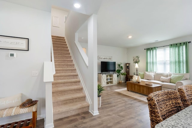 4043 Beach Way, White House, TN 37188 - living area featuring stairs, light wood finished floors, recessed lighting, and baseboards