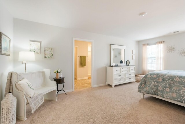 4043 Beach Way, White House, TN 37188 - carpeted bedroom featuring connected bathroom and baseboards