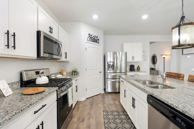 4043 Beach Way, White House, TN 37188 - kitchen featuring stainless steel appliances, a sink, white cabinetry, pendant lighting, and recessed lighting