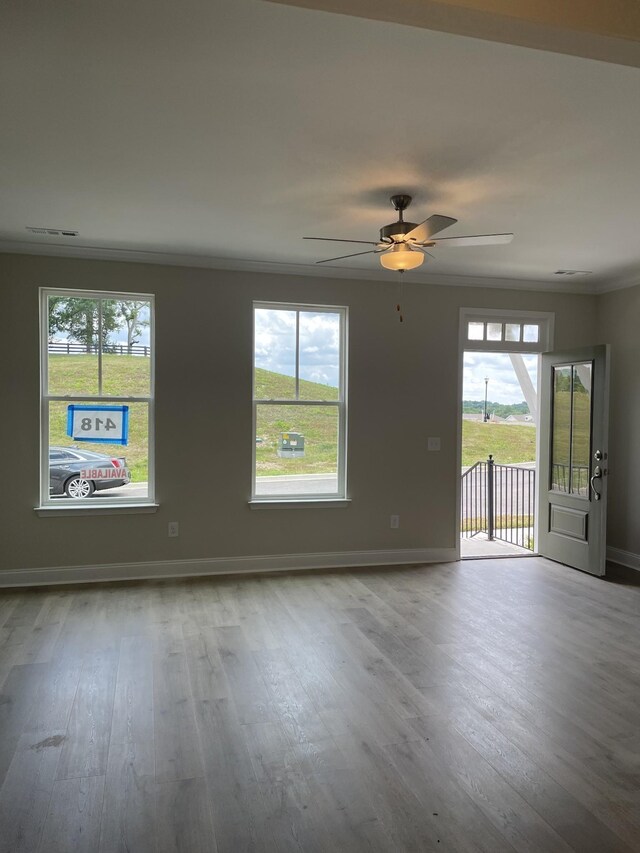 332 Savoy Loop, Nolensville, TN 37135 - empty room with healthy amount of natural light, wood finished floors, baseboards, ceiling fan, and ornamental molding