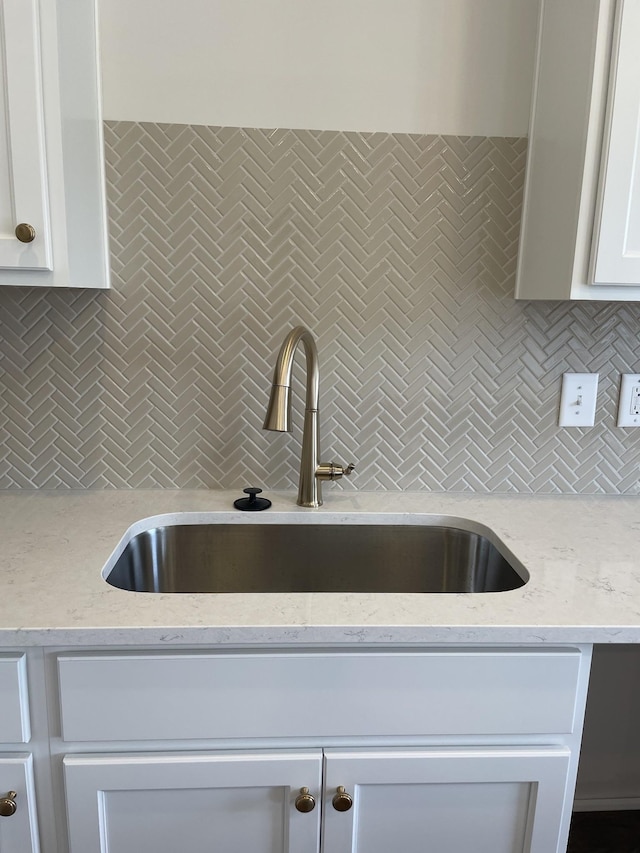 332 Savoy Loop, Nolensville, TN 37135 - kitchen featuring a sink, decorative backsplash, white cabinetry, and light stone countertops