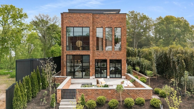 1302 Pillow St, Nashville, TN 37203 - back of house with brick siding and a patio