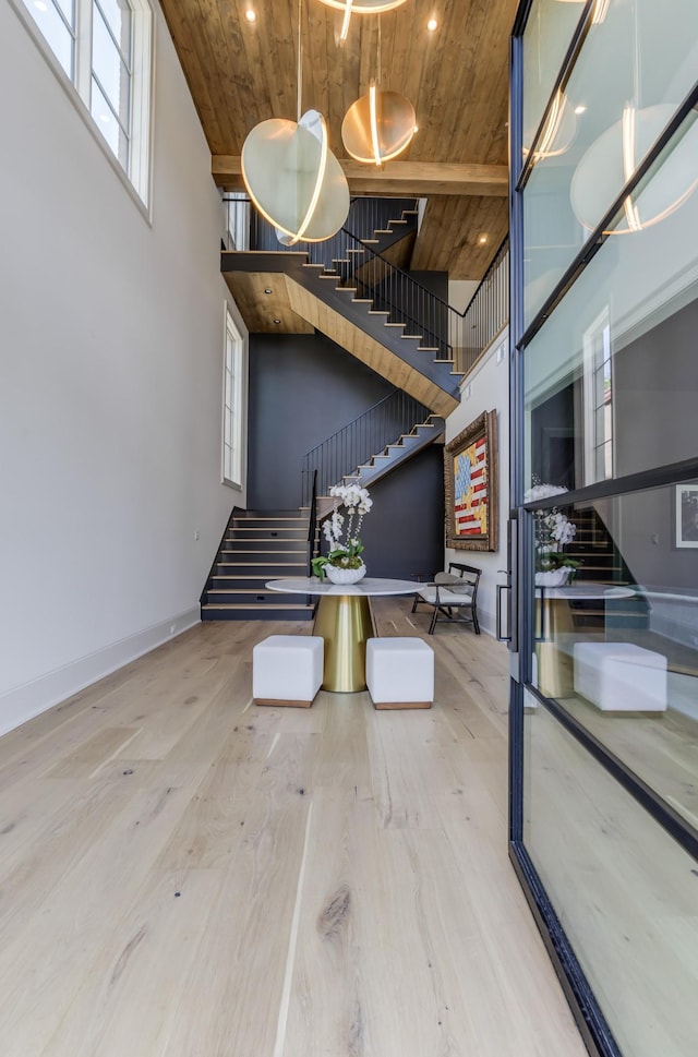 1302 Pillow St, Nashville, TN 37203 - staircase featuring wooden ceiling, a high ceiling, wood finished floors, baseboards, and recessed lighting