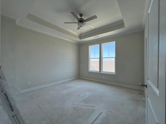 254 Savoy Loop, Nolensville, TN 37135 - empty room featuring a tray ceiling, ornamental molding, ceiling fan, and baseboards