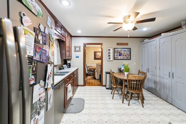 100 Townview Dr, Smyrna, TN 37167 - kitchen featuring appliances with stainless steel finishes, light floors, ceiling fan, light countertops, and ornamental molding
