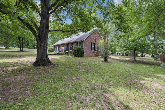 100 Townview Dr, Smyrna, TN 37167 - view of front facade with brick siding and a front lawn