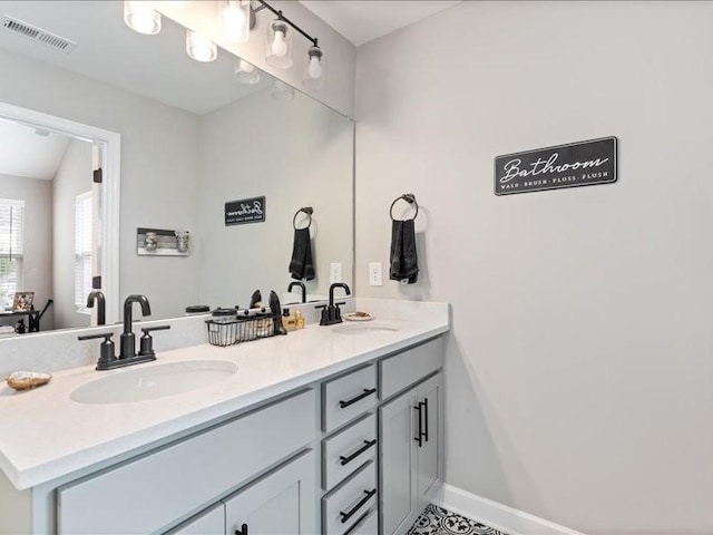 401 Queen Ln, Gallatin, TN 37066 - bathroom featuring double vanity and baseboards
