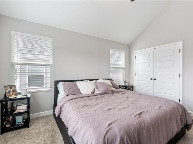 401 Queen Ln, Gallatin, TN 37066 - bedroom featuring carpet floors, baseboards, a closet, and vaulted ceiling