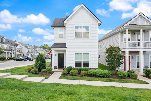 401 Queen Ln, Gallatin, TN 37066 - view of property with board and batten siding, a front yard, a residential view, and a shingled roof