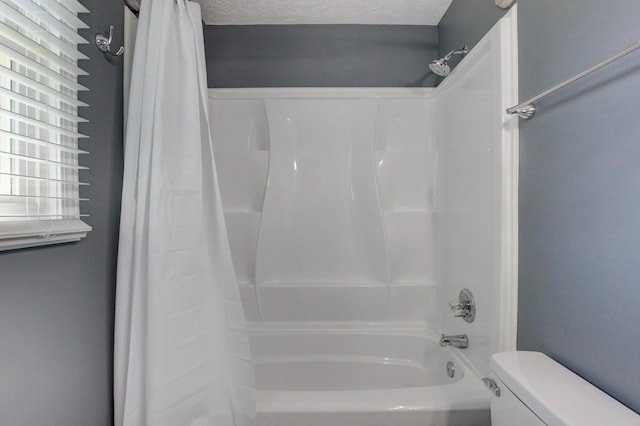 1783 Forrestdale Dr, Clarksville, TN 37042 - full bathroom featuring shower / bathtub combination with curtain, toilet, and a textured ceiling