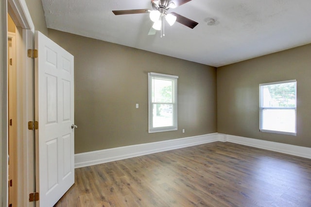 1783 Forrestdale Dr, Clarksville, TN 37042 - empty room with plenty of natural light, wood finished floors, and a ceiling fan