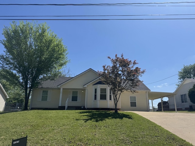 1783 Forrestdale Dr, Clarksville, TN 37042 - view of front of home featuring driveway, a carport, a front lawn, and roof with shingles