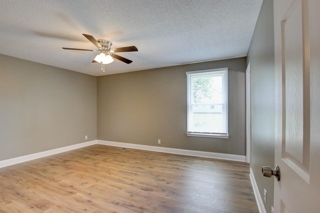 1783 Forrestdale Dr, Clarksville, TN 37042 - spare room with wood finished floors, a textured ceiling, a ceiling fan, and baseboards
