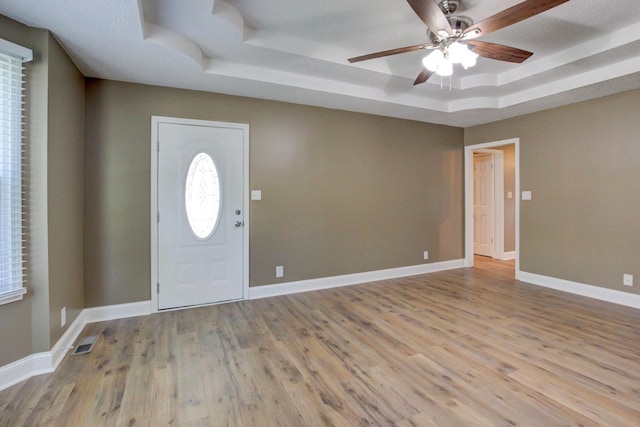 1783 Forrestdale Dr, Clarksville, TN 37042 - entryway featuring a tray ceiling, ceiling fan, wood finished floors, and baseboards