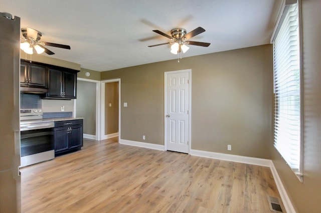 1783 Forrestdale Dr, Clarksville, TN 37042 - kitchen with stainless steel range with electric cooktop, ceiling fan, under cabinet range hood, and light countertops
