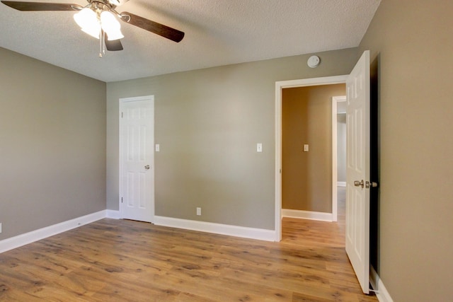 1783 Forrestdale Dr, Clarksville, TN 37042 - unfurnished room with ceiling fan, a textured ceiling, wood finished floors, a smoke detector, and baseboards