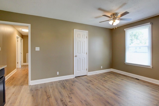 1783 Forrestdale Dr, Clarksville, TN 37042 - empty room with a ceiling fan, light wood-style flooring, and baseboards