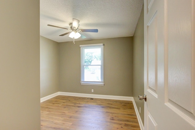 1783 Forrestdale Dr, Clarksville, TN 37042 - spare room featuring ceiling fan, wood finished floors, baseboards, and a textured ceiling
