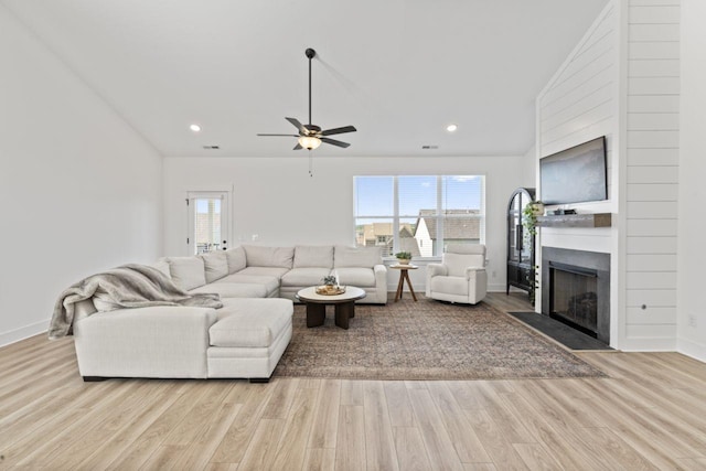 285 Gulfstream Dr, Gallatin, TN 37066 - living room with wood finished floors, ceiling fan, a fireplace with flush hearth, recessed lighting, and vaulted ceiling