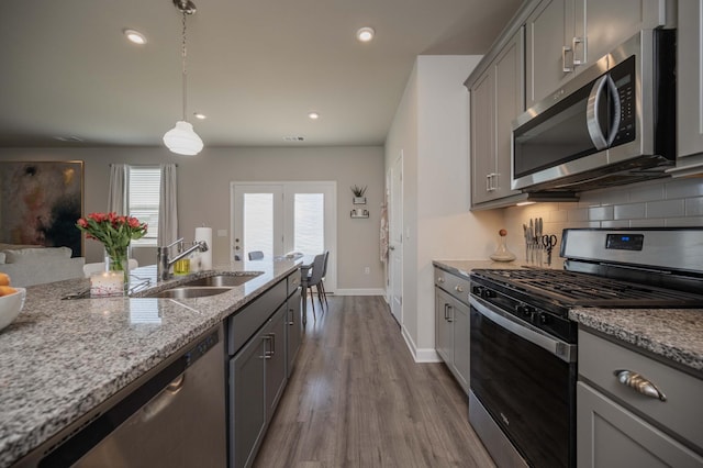 430 Burnley Way, Murfreesboro, TN 37128 - kitchen featuring stainless steel appliances, gray cabinetry, a sink, light stone counters, and dark wood-style flooring