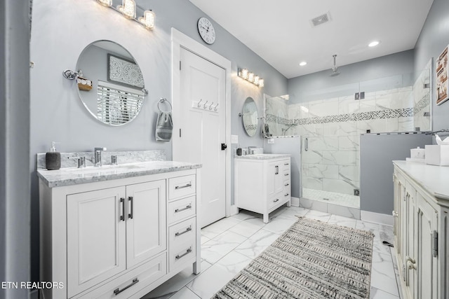 569 Station Circle Cir, Tullahoma, TN 37388 - full bathroom featuring a marble finish shower, marble look tile flooring, two vanities, and recessed lighting