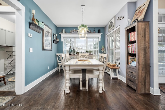569 Station Circle Cir, Tullahoma, TN 37388 - dining area with baseboards, dark wood-type flooring, and a chandelier