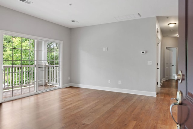 8221 Lenox Creekside Dr Unit 10, Antioch, TN 37013 - spare room featuring baseboards and light wood finished floors