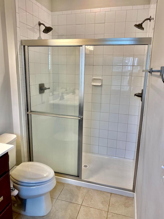4316 Summercrest Blvd Unit 800, Antioch, TN 37013 - full bathroom featuring vanity, tile patterned flooring, a shower stall, and toilet