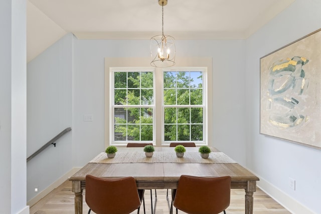 712 N 5th St, Nashville, TN 37207 - dining space featuring a chandelier, light wood-style floors, and baseboards