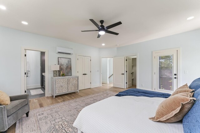 712 N 5th St, Nashville, TN 37207 - bedroom with a wall unit AC, light wood-style flooring, recessed lighting, baseboards, and connected bathroom