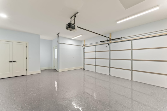 712 N 5th St, Nashville, TN 37207 - garage featuring a garage door opener and baseboards