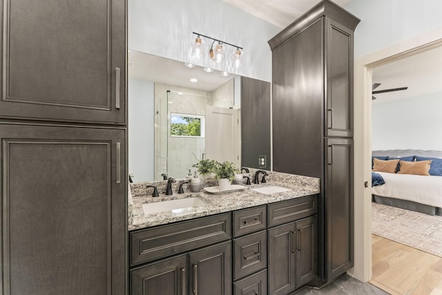 712 N 5th St, Nashville, TN 37207 - full bathroom with ensuite bath, double vanity, a shower stall, and a ceiling fan