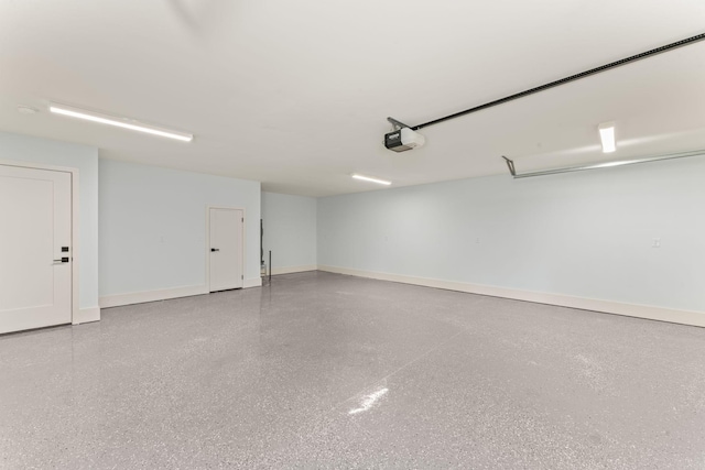 712 N 5th St, Nashville, TN 37207 - garage featuring a garage door opener and baseboards
