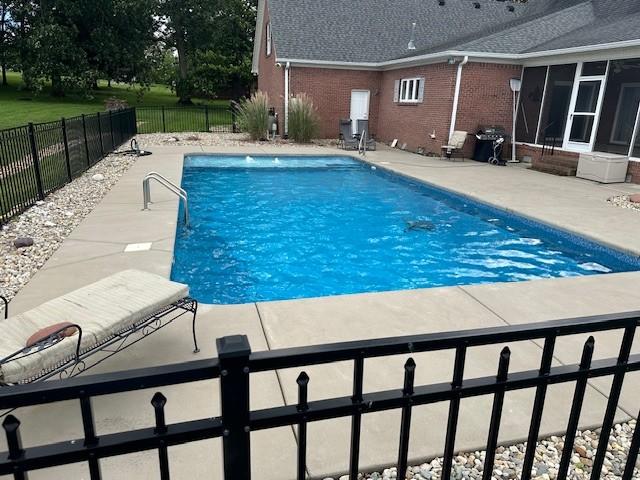 106 Rigney Rd, Manchester, TN 37355 - view of swimming pool with a sunroom, a patio, and a fenced backyard
