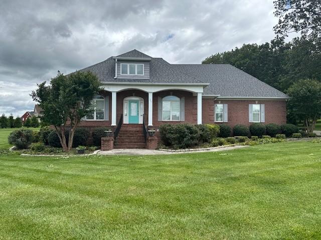106 Rigney Rd, Manchester, TN 37355 - view of front of property with a front lawn and roof with shingles