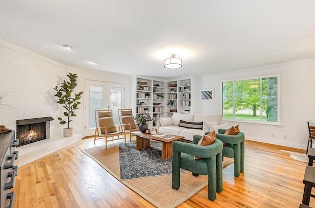 109 Pebble Creek Rd, Franklin, TN 37064 - living room with light wood-type flooring, a fireplace, crown molding, and baseboards