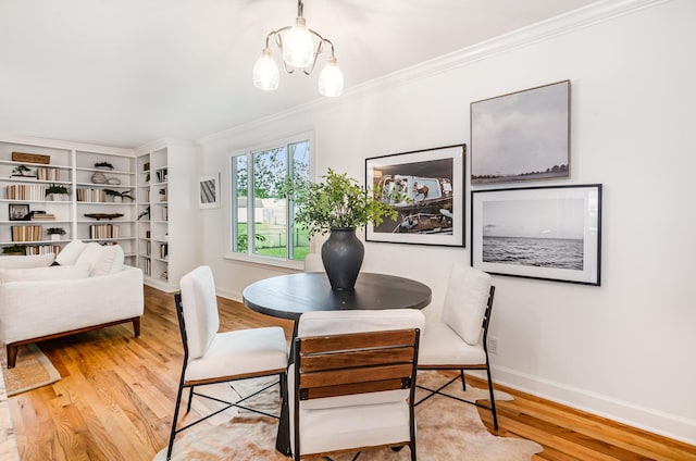 109 Pebble Creek Rd, Franklin, TN 37064 - dining area featuring wood finished floors, crown molding, baseboards, and a chandelier