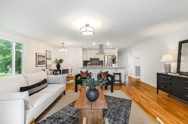 109 Pebble Creek Rd, Franklin, TN 37064 - living area featuring crown molding, a chandelier, light wood-style floors, baseboards, and recessed lighting