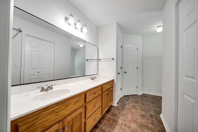 210 Apache Trl, White House, TN 37188 - full bath featuring double vanity, a closet, baseboards, and stone finish floors