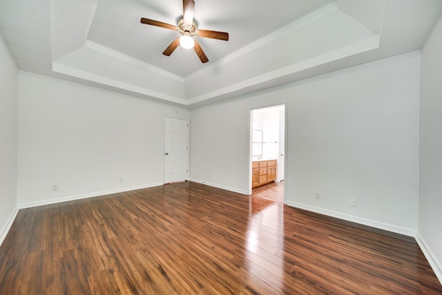 210 Apache Trl, White House, TN 37188 - unfurnished room featuring a tray ceiling, a ceiling fan, dark wood finished floors, and baseboards