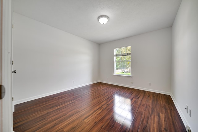 210 Apache Trl, White House, TN 37188 - unfurnished room featuring dark wood-type flooring and baseboards