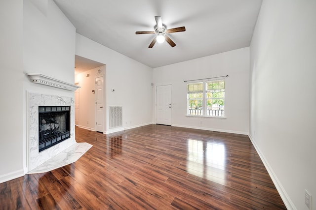210 Apache Trl, White House, TN 37188 - unfurnished living room featuring ceiling fan, a high end fireplace, wood finished floors, and baseboards