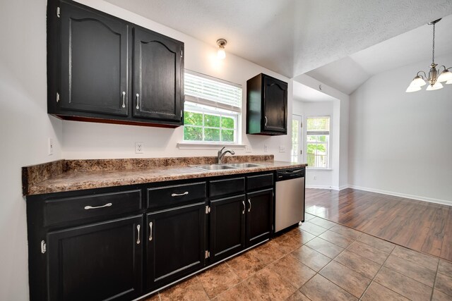 210 Apache Trl, White House, TN 37188 - kitchen featuring dishwasher, dark cabinets, a sink, lofted ceiling, and a chandelier