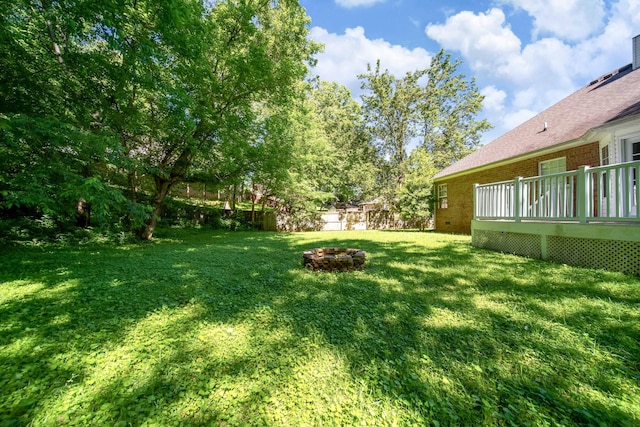 210 Apache Trl, White House, TN 37188 - view of yard featuring an outdoor fire pit and a wooden deck