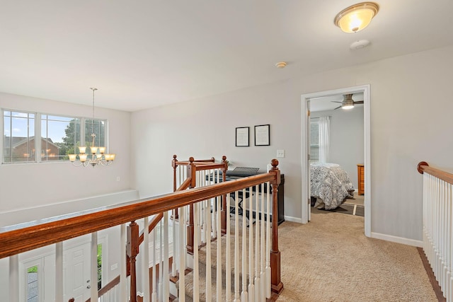 2034 Lincoln Rd, Spring Hill, TN 37174 - hall featuring an upstairs landing, light carpet, a chandelier, and baseboards