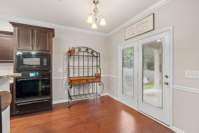 2034 Lincoln Rd, Spring Hill, TN 37174 - doorway featuring a chandelier, wood-type flooring, crown molding, and baseboards